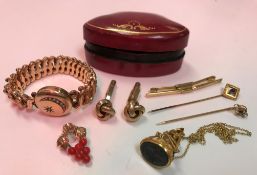 A collection of gold and yellow metal jewellery to include two 9 carat gold tie pins,