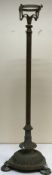 A circa 1900 brass oil lamp standard on a reeded column to tri-form reeded base and circular feet,