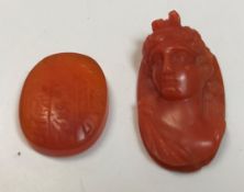 A Victorian pink coral cameo depicting a maiden, 3 cm high and a cornelian lozenge shaped seal,