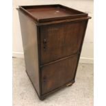 A mahogany and cross-banded side table with dummy drawer and brushing slide on square tapered legs,