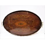 An Edwardian mahogany and inlaid and penwork decorated oval drinks' tray with two brass handles,