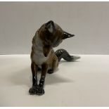 A Rosenthal figure of a pouncing fox by M H Fritz 24.5 cm long x 13.