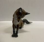 A Rosenthal figure of a pouncing fox by M H Fritz 24.5 cm long x 13.