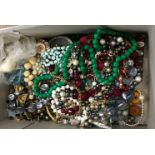 A box of assorted vintage costume jewellery to include mainly beaded necklaces