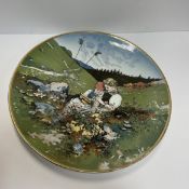 A Villeroy & Boch Mettlach charger decorated with alpine scene of young boy and girl picking