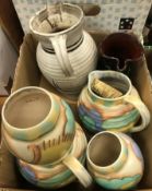 Two boxes of various Studio pottery to include Carltonware floral decorated jugs and vases,