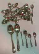 A collection of spoons to include a set of twelve Peruvian foliate decorated teaspoons and matching