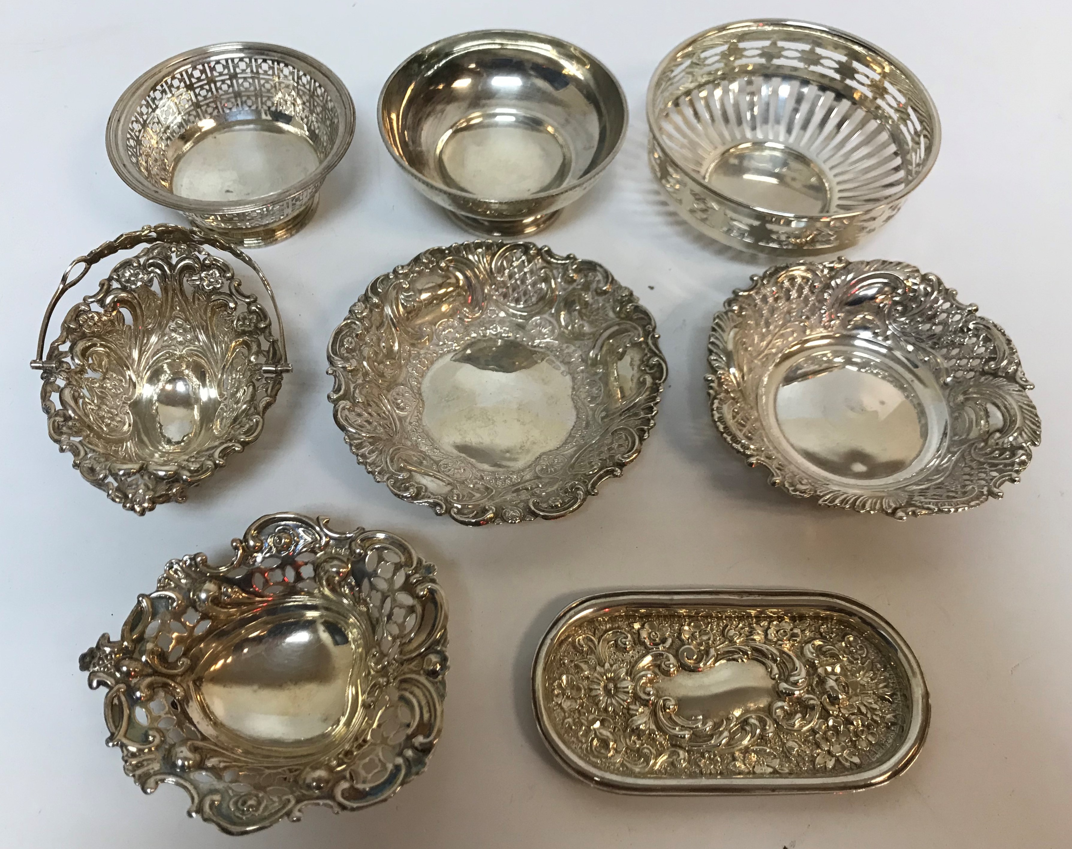 A collection of eight various silver bon bon dishes/trinket dishes some with pierced decoration to