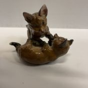 A Rosenthal figure group of two fox cubs playing by Fritz Heidenreich approx. 15.5 cm long x 9.