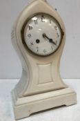 A 19th Century French white marble cased mantel clock of lancet form,