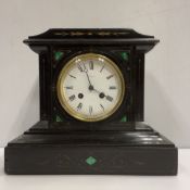 A late Victorian black marble and malachite inlaid mantel clock,