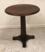 A set of six modern mahogany and stained beech pedestal occasional tables,