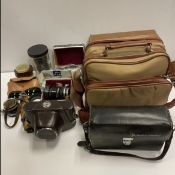 A collection of various mid 20th Century photographic equipment to include Miranda camera,
