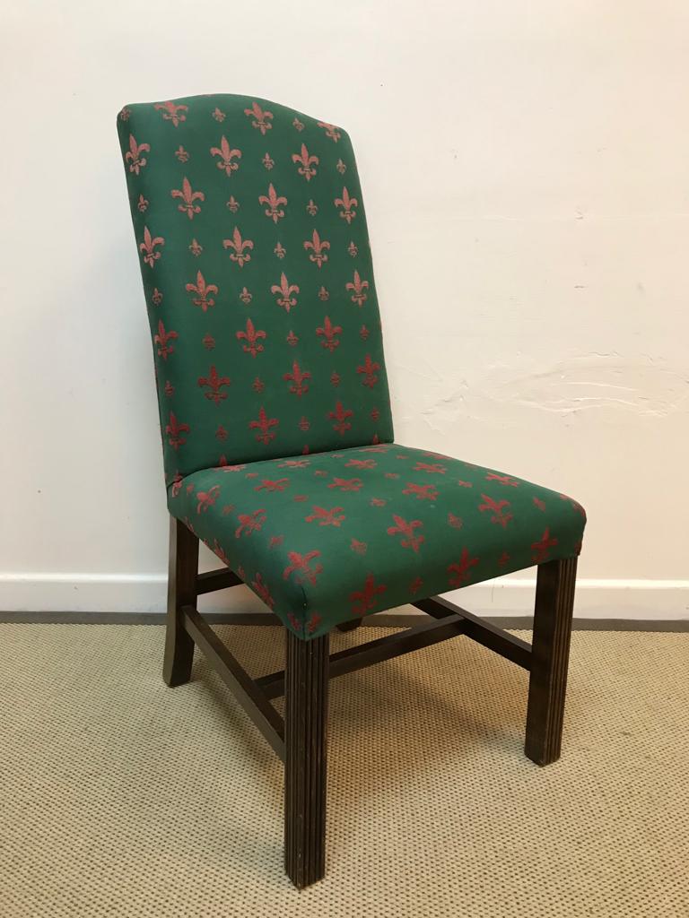 A set of eight modern fleur de lys red on green upholstered high back dining chairs on reeded beech