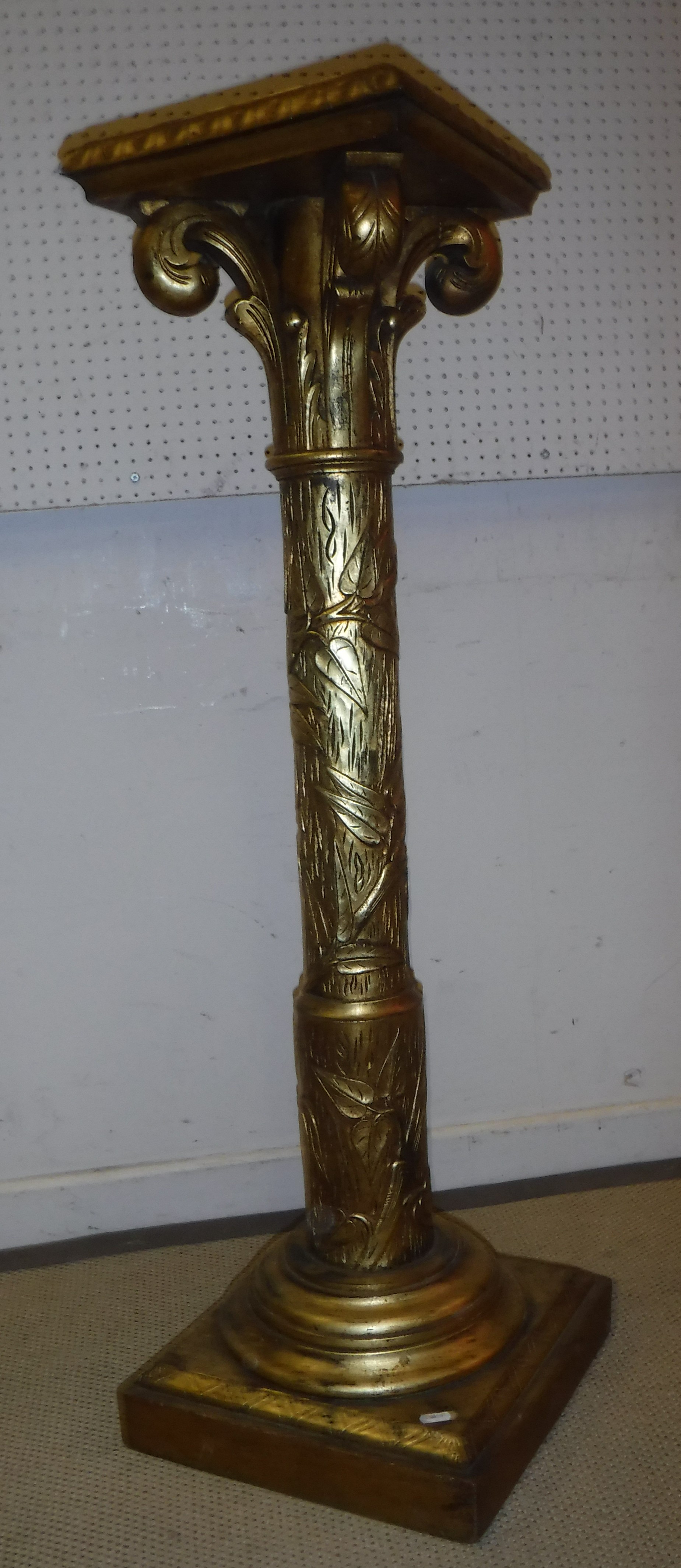 A 20th Century carved giltwood torchere stand in the 19th Century Aesthetic taste,