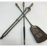 A set of three 19th Century brass handled steel fire irons,