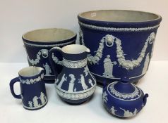 Five items of Wedgwood blue jasperware including large jardiniere with swag and classical figure