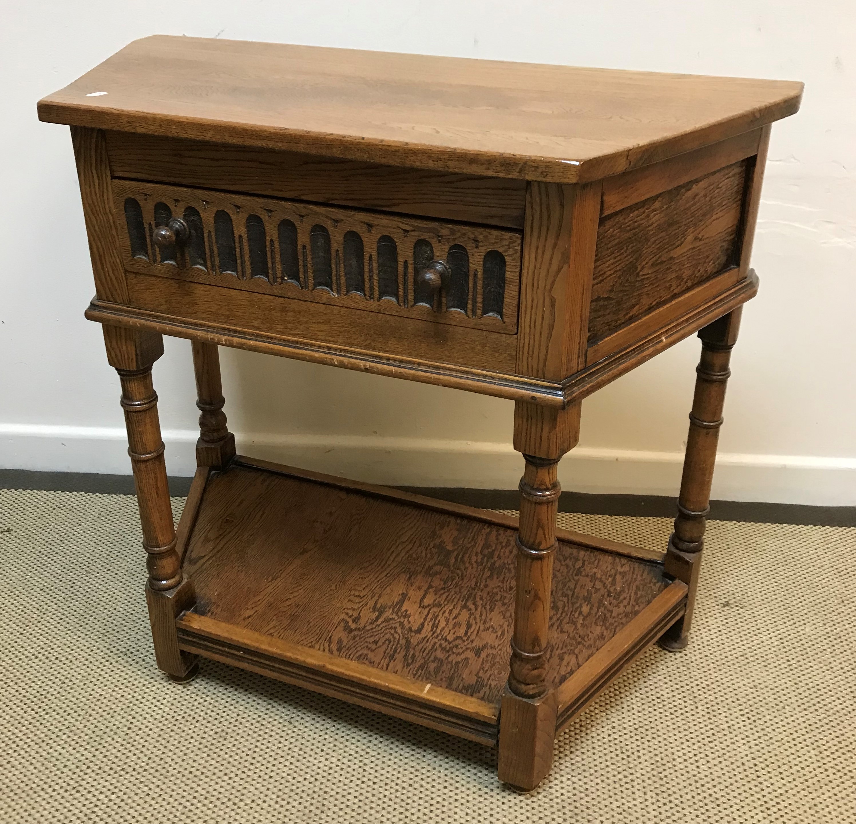 An oak court cupboard of small proportions in the 17th Century style,