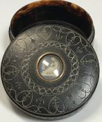 A 19th Century carved tortoiseshell circular box,