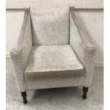 A set of four modern beige and cream upholstered scroll arm chairs on turned front legs,