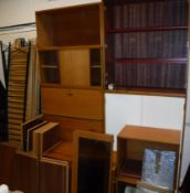 A collection of Ladderax teak furniture including two door wardrobe,