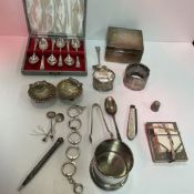 A collection of silver and white metal wares to include a cased set of six silver coffee spoons,