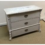 A Continental painted pine three drawer commode on shaped feet 106 cm wide x 53 cm deep x 82 cm