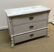 A Continental painted pine three drawer commode on shaped feet 106 cm wide x 53 cm deep x 82 cm