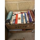 A collection of thirteen boxes of various books including novels, references,