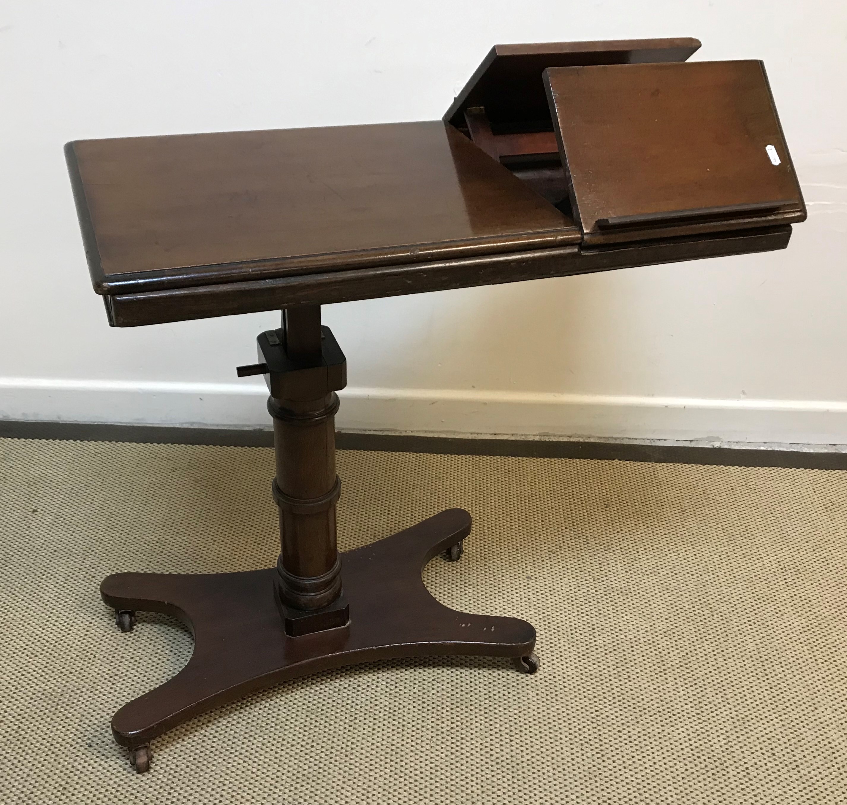 A Victorian mahogany adjustable reading table in the manner of Carter 43 cm wide x 81 cm long (top)