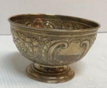 A silver rose bowl with embossed floral and swag decoration (Sheffield, date mark rubbed), 14.