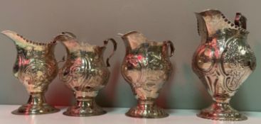 A collection of four various Georgian silver cream jugs with varying dates and makers to include
