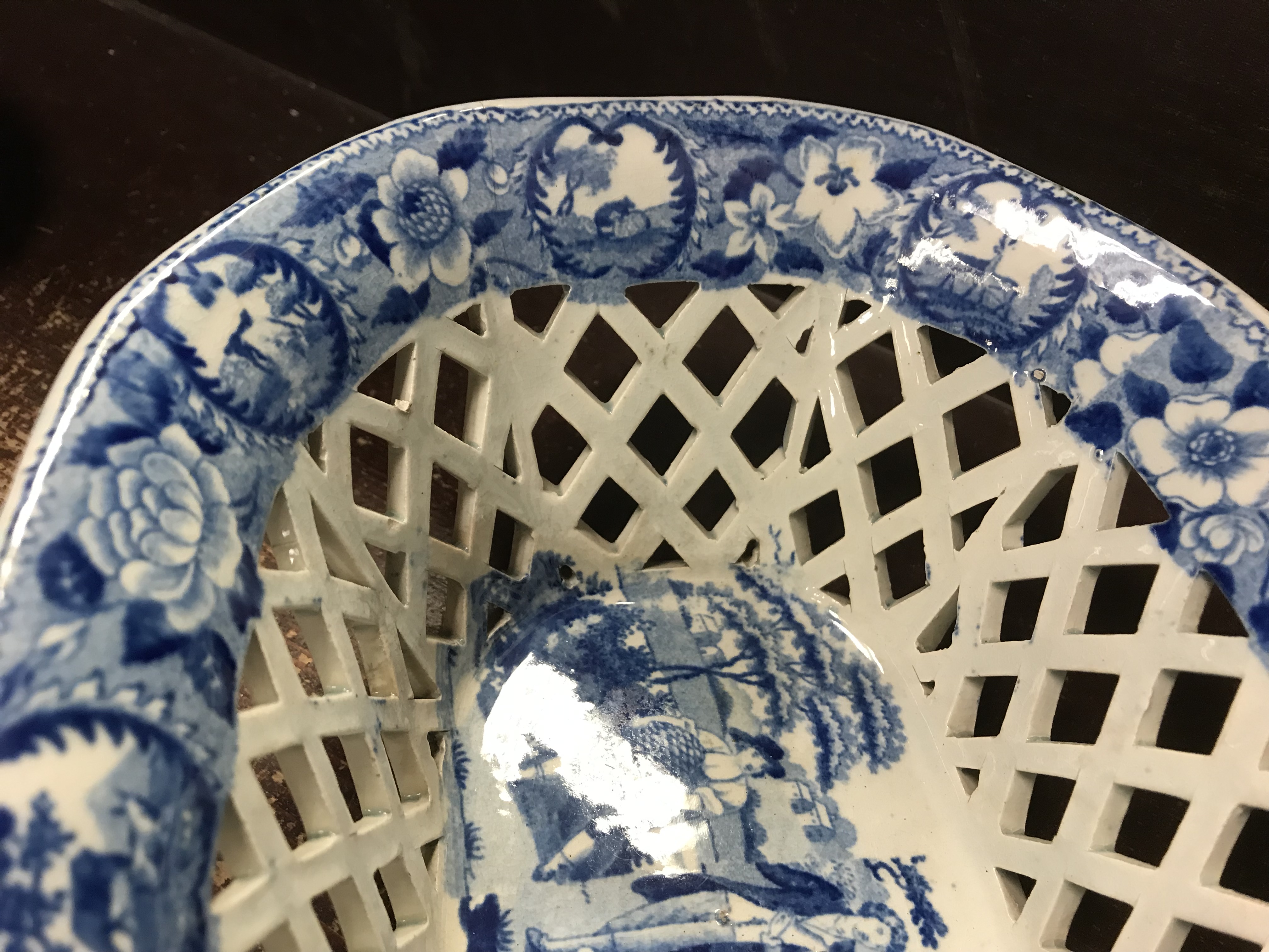 An early 19th Century blue and white transfer decorated pottery chestnut basket and stand, - Image 15 of 35