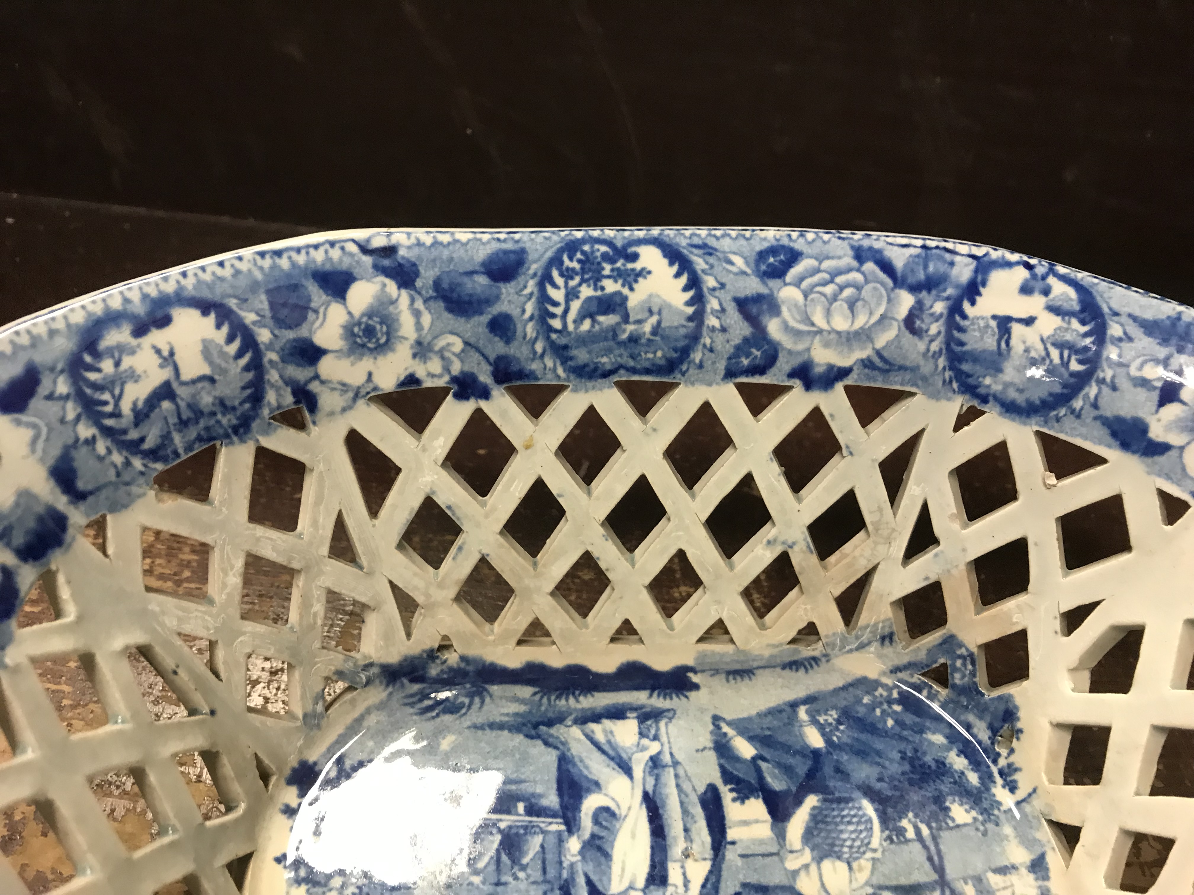 An early 19th Century blue and white transfer decorated pottery chestnut basket and stand, - Image 4 of 35
