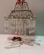 A three tier cut glass drop ceiling light,