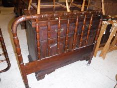 A pair of modern mahogany single bedsteads with turned and ringed railed ends,