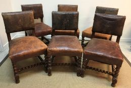 A set of six late Victorian studded leather upholstered oak framed dining chairs in the 17th