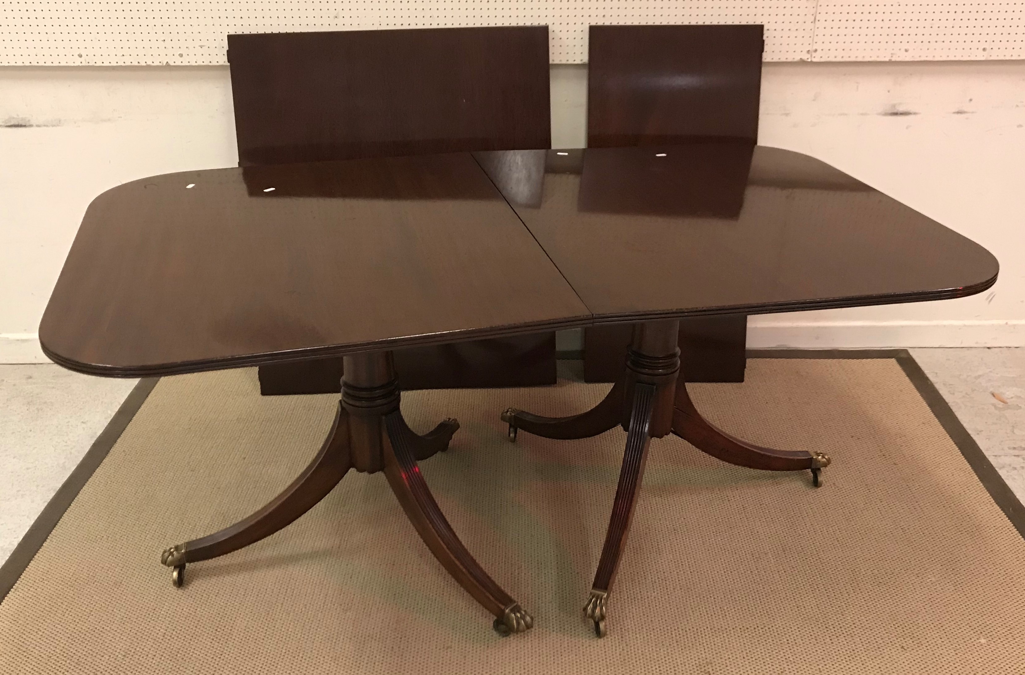 WITHDRAWN A mahogany rounded rectangular dining table in the George III taste,