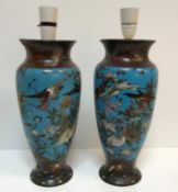 A pair of circa 1900 Chinese cloisonne vases decorated with birds and butterflies amongst