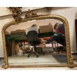 A late Victorian carved giltwood and gesso framed overmantel mirror with egg and dart frame and