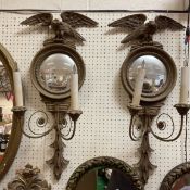 A pair of 20th Century giltwood wall lights in the Regency taste,