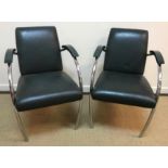 A pair of Art Deco style chrome framed and green leather upholstered elbow chairs with green