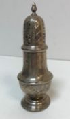 A silver sugar caster of lantern form (by C E, London 1927), 16.5 cm high, total weight 3.