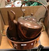 A Victorian copper kettle, a copper and brass handled oval pan,