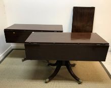 An early 19th Century mahogany twin pillar dining table as two drop-leaf Pembroke tables on turned