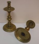 A pair of 18th Century brass candlesticks with drip trays on circular bases,