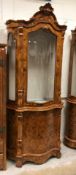 A modern Italian walnut and marquetry inlaid serpentine fronted display cabinet, the upper section