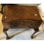 A 1930's mahogany and inlaid inverted serpentine fronted two drawer canteen table on shell carved
