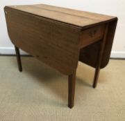 A 19th Century oak rounded rectangular drop-leaf dining table with single end drawer on square