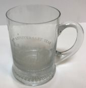 An etched glass mug inscribed "25th Anniversary Year Coronation St 1960-1985", 13 cm high, a